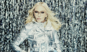 Madonna poses in a metallic silver jacket