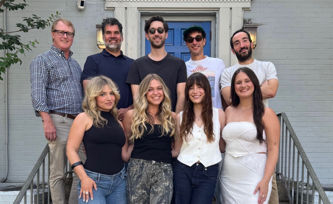 Riley Biederer poses with her management, Superreal and Reservoir colleagues