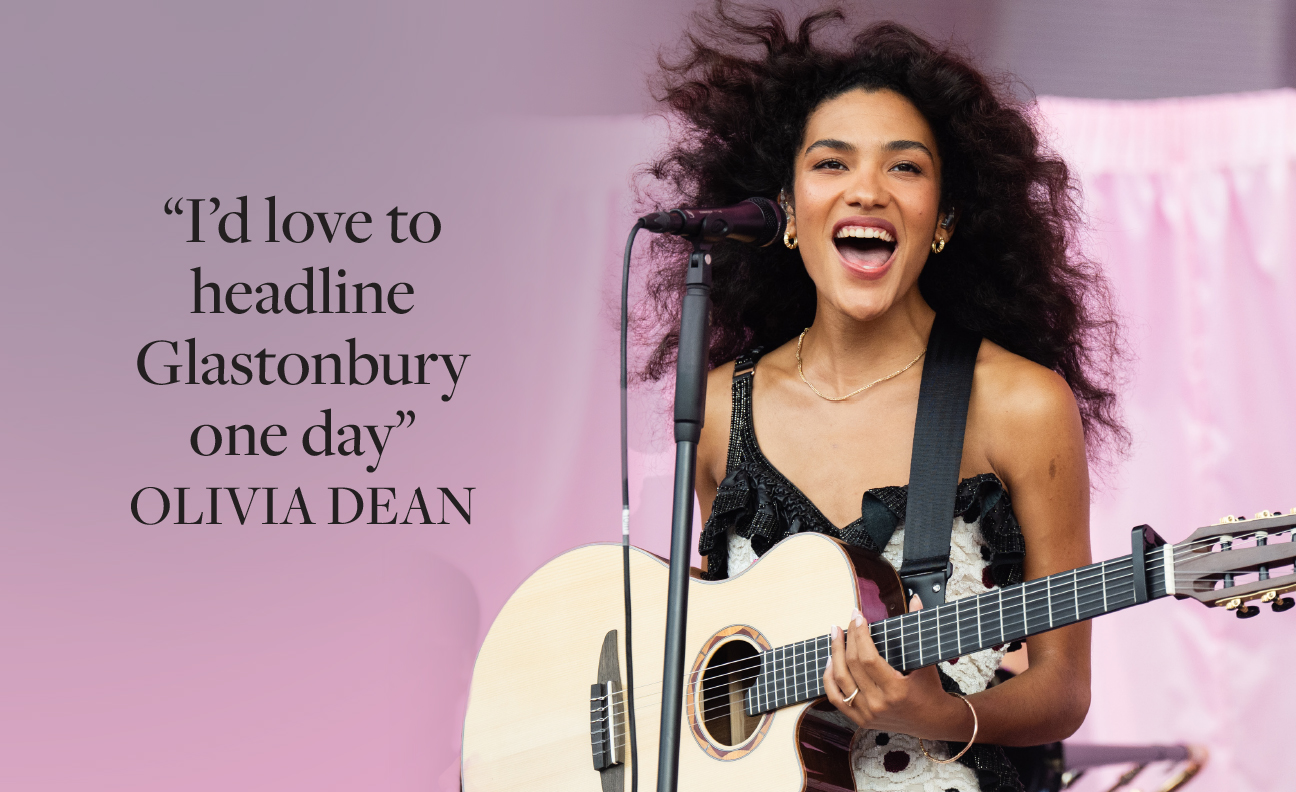 Olivia Dean playing a guitar 